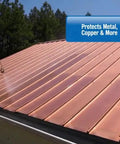 Man applying Heavy Duty Tough As Nails Clear Roof Sealer on a copper metal roof to stop leaks.