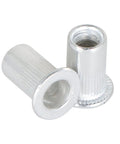Close-up of aluminum rivet nuts from 100 Pcs kit, 10-24 UNC fasteners for auto and DIY projects, showing threaded inserts for metal panels.