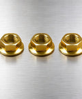 Tough As Nails Hex Flange Nuts For Lawn Mower Blade Spindle Swap, 3 heavy duty yellow nuts on brushed metal background.