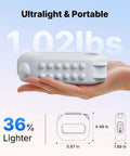 Hand holding grey vibration plate, 1.02 lbs ultralight model with controls, for women, fitness workout and lymphatic drainage.