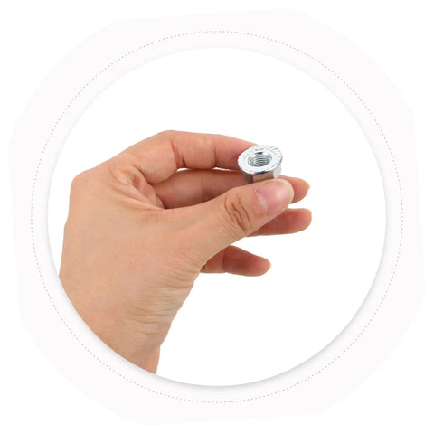 Hand holding a hex wheel axle nut from the Beefed Up Heavy Duty Bicycle Wheel Axle Nut Kit With Carbon Steel Nuts And Anti Rotation Tab Washers For Mountain And Road Bikes Secure Retention Hardware To Prevent Loosening During Rough Rides