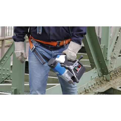 Person holding Super Lightweight Portable Magnetic Drill Press By CS Unitec MAB 100 K Compact Cordless Unit weighing 21.8 lbs.
