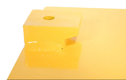 Close-up of yellow FCB-818 Class II Fork Truck Carriage Bumper with molded rubber and steel for impact protection and load safety.
