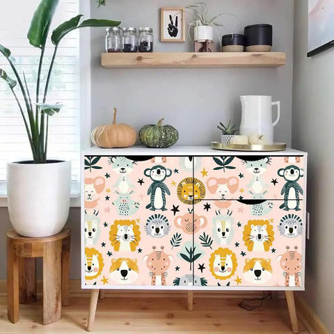 Dead Simple Peel And Stick Wallpaper Pink Safari Jungle Zoo Design Self Adhesive Vinyl Roll on a white dresser with animal prints.
