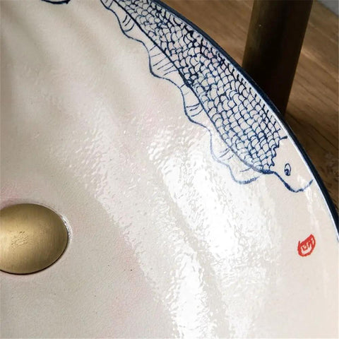 Close-up of USZWBY Vessel Vanity Sink Basin Hand Painted Wash Basin showing design, drain, and glossy finish for bathroom use.
