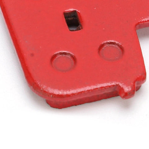 Close-up of red semi-metallic disc brake pad corner from Eight Pack SemiMetallic Disc Brake Pads For Mountain And Electric Bikes Durable