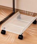 Heavy Duty Black Metal Under Desk Cpu Stand With Smooth Locking Casters, PC tower cart with wheels on a wooden floor.