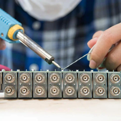 Hand using soldering iron with Six Piece Soldering Tips Set For ST Series Irons ST7 WLC100 for precise, easy welds
