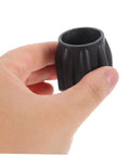 Hand holding a black diving tank valve replacement part for scuba tanks easy install accessory with durable build.