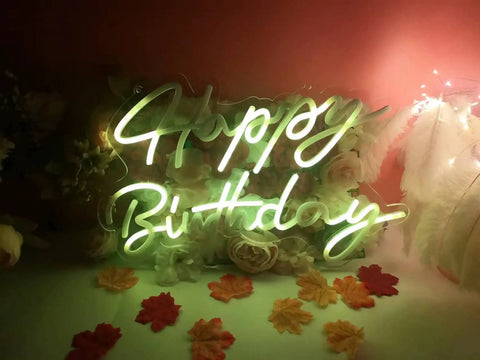 Lit LED Neon Sign Night Light For Wall Decor And Party Ideal For Bedroom Living Room Bar Wedding Home Birthday Christmas USB Powered 5V With Chain Light Modulator Energy Saving Acrylic Neon 16.1X11 Inches showing 'Happy Birthday' in green glow against a floral background