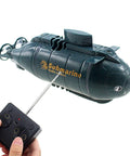 Mini RC Nuclear Submarine Toy Remote Control Boat With Realistic Dive Function And Surface Modes For Serious Ocean Play 6 Channel Water Toy For Kids Blue Gift With Durable Build And Easy Steering featuring a black submarine model and handheld controller.