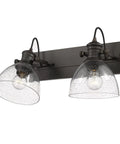 Hines Vanity Light In Rubbed Bronze With Seeded Glass Shade, 2-light steel fixture, transitional design for bathrooms and hallways