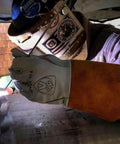 Unisex X Large Tig Welding Gloves With Pearl Top Grain Goatskin on welder using TIG torch, brown leather cuff