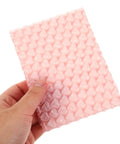 Hand holding Pink Heart Shaped Bubble Mailers Pack For Jewelry And Delicate Items With Shockproof Plastic Bags