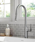 Oletto Tall Modern Pull Down Kitchen Faucet With Single Handle Spot Free Stainless Steel Finish in a stylish kitchen setting