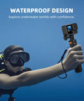 Diver holding Pocket 3 In One Vlog Tripod Selfie Stick With Extendable Desk Stand underwater, showcasing waterproof design.