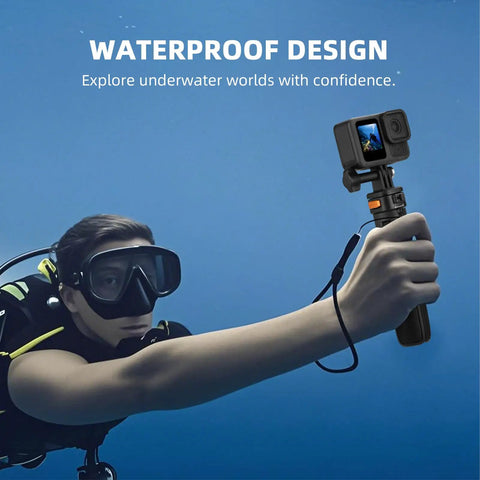 Diver holding Pocket 3 In One Vlog Tripod Selfie Stick With Extendable Desk Stand underwater, showcasing waterproof design.