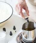 Person preparing Stearic Acid Wax Beads 400g For Soap Making, Candles, Cosmetics, DIY Skincare, Rubber And Plastic Additive