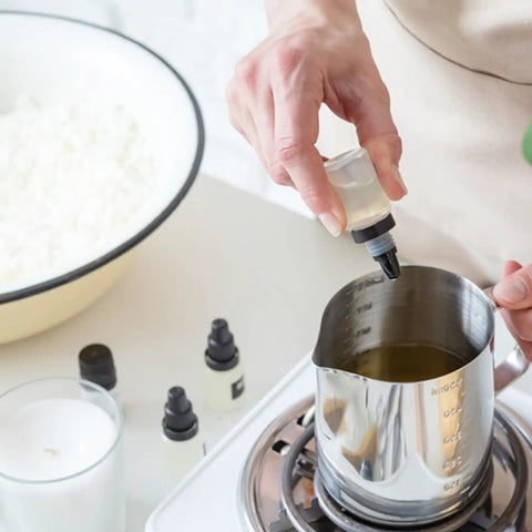 Person preparing Stearic Acid Wax Beads 400g For Soap Making, Candles, Cosmetics, DIY Skincare, Rubber And Plastic Additive