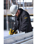 Construction worker wearing Toasty Three Heating Zones Heated Lightweight Soft Shell Jacket With Led Controller.