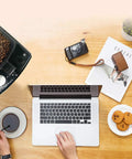 No Sweat Bean To Cup Coffee Maker With Fully Automatic One Button Brew, stainless steel body, coffee brewing at a workspace.