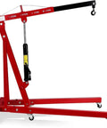 Heavy Duty 2 Ton Engine Hoist Folding Cherry Picker Shop Crane With hydraulic tilt boom and robust outriggers in red.