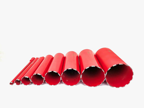 Diamond core drill bit set, eight red concrete bits with segmented edges, varying diameters.