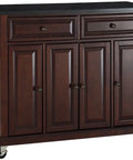 Slick Granite Top Rolling Kitchen Island Cart With Solid Mahogany Frame And Vintage Brass Pulls, two drawers, ample storage, locking wheels.