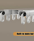 Close-up of heavy duty ceiling curtain track system with double rails, built-in mute bar, ceiling mounted in white finish.