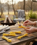 Person using All Natural Cotton And Beeswax Fire Starter For Outdoor Camping And Home Fires Waterproof Easy Ignite For Campfires Fireplaces Grills