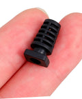 Close-up of a black piece from 100 Pieces Cable Glands Protector Kit Strain Relief Cord Grips For Electrical Wires held between fingers.