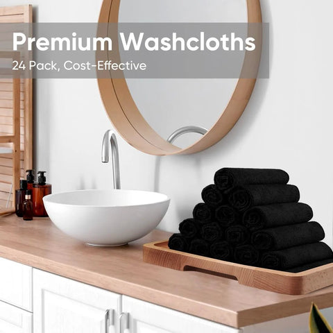 HOMEXCEL black washcloths 24-pack microfiber towels on a wooden tray beside a bathroom sink, 12x12 inches.