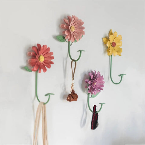 Rock Solid Steel Wall Mount Coat Rack Multipurpose Entryway Hanger for Coats Bags Keys and Towels on a wall with floral designs.