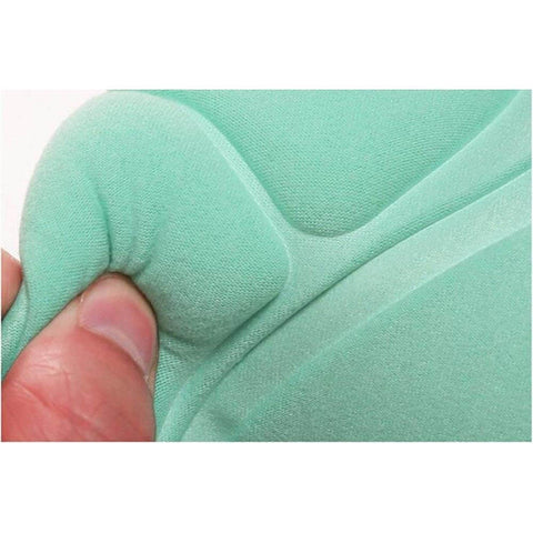 Close-up of hand pressing teal foam fabric cushion