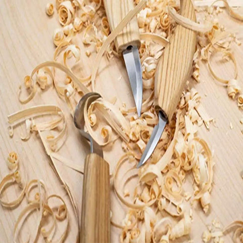 Premium Wood Carving Tools Kit Includes Hella Sharp Sloyd Knife And Hook Blade With Chip Carver resting on wood shavings.