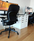 Heavy Duty Office Chair Caster Wheels With Threaded Stem Three Eighths 16X1 on black office chair in modern workspace.