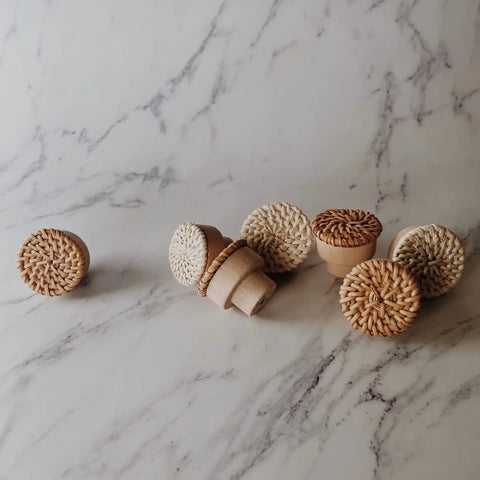 Six Piece Dope Boho Rattan Knobs For Dresser Drawers And Cabinets Handmade Wicker Woven Decorative Pulls In Caramel On Marble Surface