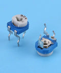 Blue and white vertical PCB mount trimmer potentiometers from 150 Piece Resistor And Trimmer Potentiometer Assortment Kit