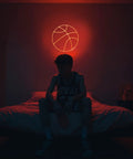 Basketball Neon Sign LED Light 11.8 Inch for Bedroom Decor, illuminating a game room with dope sports aesthetic above bed.