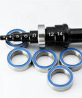 Blue Rubber Sealed 6700 Series Ball Bearing 2RS 10x15x4mm With 10mm Inner Bore For RC Cars And Miniature Gear Systems Ready For Precision Play And Simple Replacement 1 Piece Built For RC Hobbyists And Workshop Upgrades With Smooth Operation And Low shown with a measuring tool