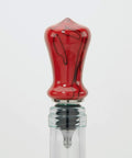 Premium Stainless Steel Bottle Stopper Kit For Woodturning Lathes Includes Five Heavy Duty Threaded Caps showing red bottle stopper on glass.