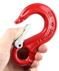 Hand holding Clevis Slip Hook G80 Rotary Eye Hoist Hook With Lock For Safe Lifting, forged steel, red rigging hardware, wide opening.