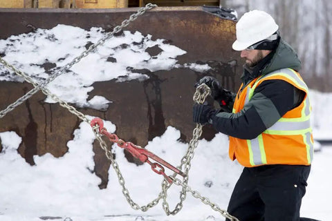 Worker using Winter Work Gloves With Waterproof Barrier And 100g PrimaLoft Gold Insulation Touchscreen Compatible in snowy job site.