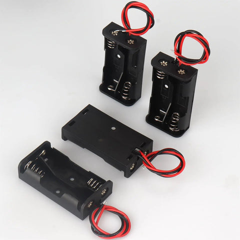 Four Pack Of Hella Reliable AA Battery Holders With Attached Leads And Stainless Steel Contacts For Effortless Power Delivery And A Straight Up No Fuss Housing That Keeps Batteries Securely Locked Away, featuring two holders and two leads.