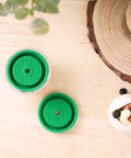 Top view of Reusable Coffee Pods And Discs For Nespresso VertuoLine And Vertuo Machines Rich Crema Version on wooden table.