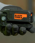 Hand holding Magnetic Pocket Laser Level with 360 Degree Wall Attachment, compact size, labeled Klein Tools