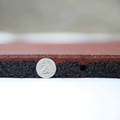 Close-up of Interlocked Outdoor Rubber Tiles 20x20 Inch 1 Inch Thick For Playground And Backyard Gym Flooring next to a coin