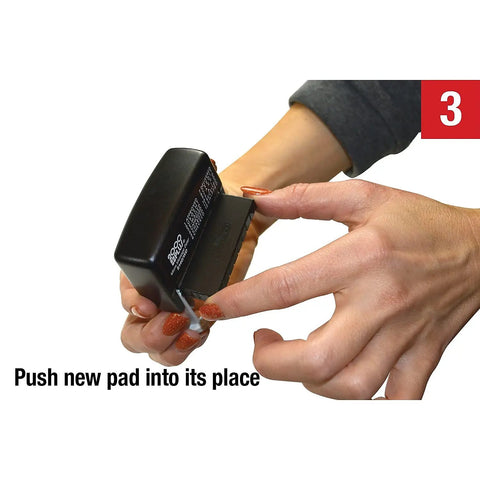 Close-up of hands inserting a new pad into a Slick Self Inking Micro Message Dater Stamp With Quick Flip Phrases For Office Organization And Zero Mess Record Keeping Is A Legit Daily Go To Business Supply Staple.