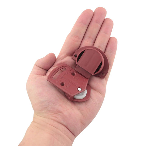 16 Pieces Plastic Red Cabinet Sliding Door Pulley With Screws Wardrobe Roller Track Gear Panel Interior Kit held in a hand