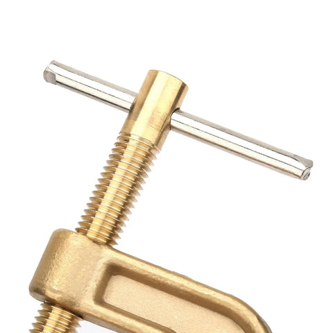 Top Notch 500 Amp Brass Grounding Clamp G-Shape For Welders close-up view showing brass material and threaded design.